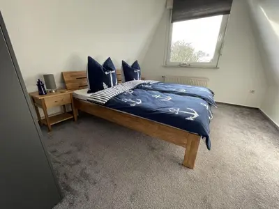 Ein Bett oder Betten in einem Zimmer der Unterkunft Kampweg 26