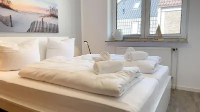 Ein Bett oder Betten in einem Zimmer der Unterkunft Nige Ooge 7