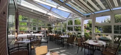 Ein Restaurant oder anderes Speiselokal in der Unterkunft Hotel am Hasengarten