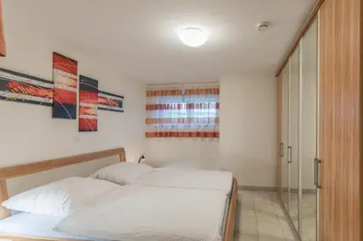 Ein Bett oder Betten in einem Zimmer der Unterkunft Dünenflair Wohnung 2