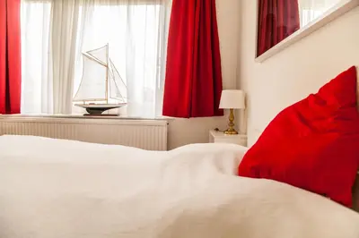Ein Bett oder Betten in einem Zimmer der Unterkunft Ferienanlage Duhnen