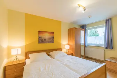Ein Bett oder Betten in einem Zimmer der Unterkunft Haus Stranddüne Wohnung 11