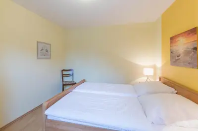 Ein Bett oder Betten in einem Zimmer der Unterkunft Haus Stranddüne Wohnung 11
