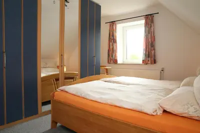 Ein Bett oder Betten in einem Zimmer der Unterkunft Ferienwohnung am Schwarzen Wehl