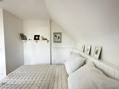 Ein Bett oder Betten in einem Zimmer der Unterkunft Haus Wexler 5 - OG