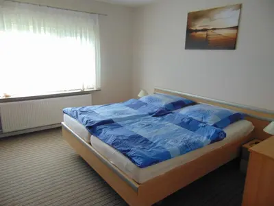 Ein Bett oder Betten in einem Zimmer der Unterkunft Ferienwohnung Ehrich nahe Otterndorf