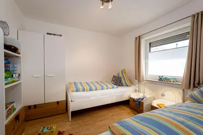 Ein Bett oder Betten in einem Zimmer der Unterkunft Ferienhaus Seebär