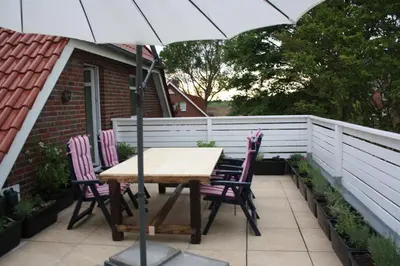 Ein Balkon oder eine Terrasse in der Unterkunft Strandrose