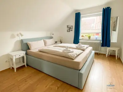 Ein Bett oder Betten in einem Zimmer der Unterkunft Urlaub in der Grimmershörnbucht