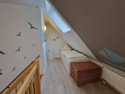 Ein Bett oder Betten in einem Zimmer der Unterkunft Haus Seewind Wohnung 3