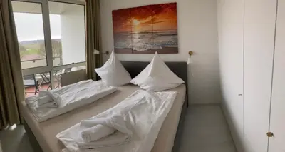 Ein Bett oder Betten in einem Zimmer der Unterkunft Vogelsand 348