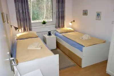 Ein Bett oder Betten in einem Zimmer der Unterkunft Voßhörn 27 Whg. 1