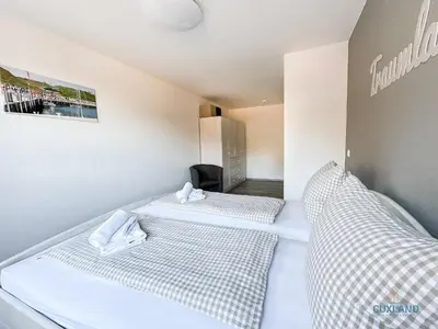 Ein Bett oder Betten in einem Zimmer der Unterkunft Haus Nordseebrandung Wohnung 2.4