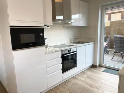 Küche/Küchenzeile in der Unterkunft Cuxhavener Straße 5/2