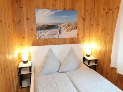 Ein Bett oder Betten in einem Zimmer der Unterkunft Chalet Martin by Interhome