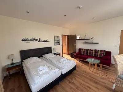 Ein Bett oder Betten in einem Zimmer der Unterkunft Pension Appartementhaus Hus Möhlenbarg
