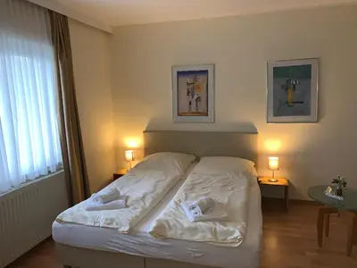 Ein Bett oder Betten in einem Zimmer der Unterkunft Pension Appartementhaus Hus Möhlenbarg