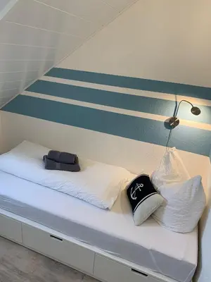 Ein Bett oder Betten in einem Zimmer der Unterkunft Wohnung 