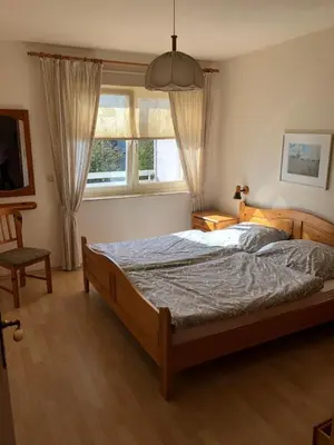 Ein Bett oder Betten in einem Zimmer der Unterkunft Ferienwohnung Op'n Rugenbarg 70 OG