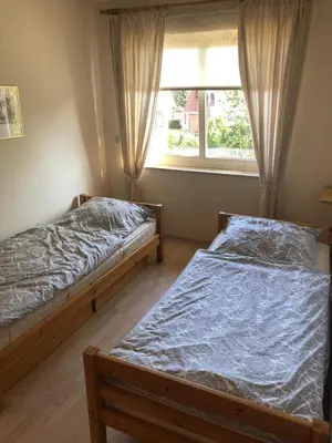 Ein Bett oder Betten in einem Zimmer der Unterkunft Ferienwohnung Op'n Rugenbarg 70 OG