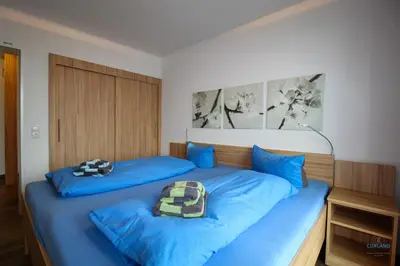 Ein Bett oder Betten in einem Zimmer der Unterkunft Residenz Hohe Lith Wohnung 23