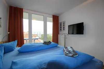 Ein Bett oder Betten in einem Zimmer der Unterkunft Residenz Hohe Lith Wohnung 23