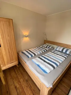 Ein Bett oder Betten in einem Zimmer der Unterkunft Strandläufer