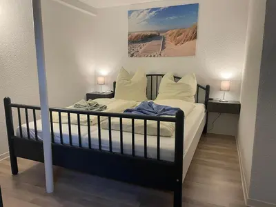 Ein Bett oder Betten in einem Zimmer der Unterkunft Strandhaus am Kurpark