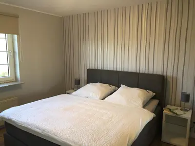 Ein Bett oder Betten in einem Zimmer der Unterkunft Marbijes Appartementhaus