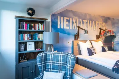 Ein Bett oder Betten in einem Zimmer der Unterkunft Heimathafen