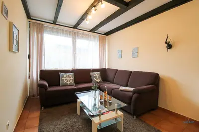 Ein Sitzbereich in der Unterkunft Ferienhaus Am Ringwall 109