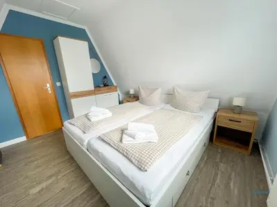 Ein Bett oder Betten in einem Zimmer der Unterkunft Ferienhaus am Ringwall 16