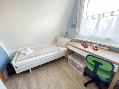 Ein Bett oder Betten in einem Zimmer der Unterkunft Ferienhaus am Ringwall 16