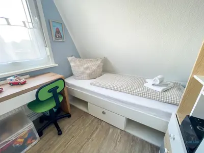 Ein Bett oder Betten in einem Zimmer der Unterkunft Ferienhaus am Ringwall 16
