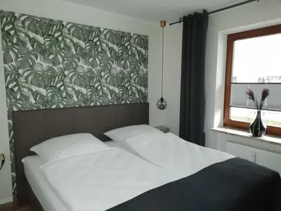 Ein Bett oder Betten in einem Zimmer der Unterkunft Wohnung Enjoy