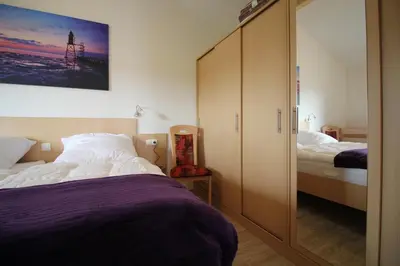 Ein Bett oder Betten in einem Zimmer der Unterkunft Ferienhaus Nixe7
