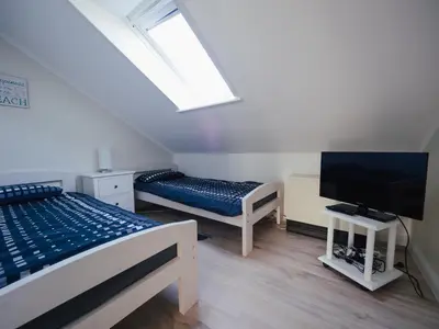 Ein Bett oder Betten in einem Zimmer der Unterkunft Beachcomber House A