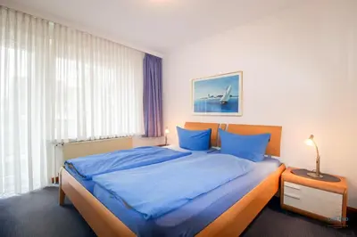 Ein Bett oder Betten in einem Zimmer der Unterkunft Strand und zentrumsnahe Ferienwohnung für bis zu 4 Personen in Döse