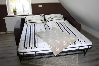 Ein Bett oder Betten in einem Zimmer der Unterkunft Ferienwohnung Elbkoje