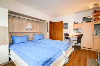 Ein Bett oder Betten in einem Zimmer der Unterkunft Strand und zentrumsnahe Ferienwohnung für bis zu 2 Personen in Döse