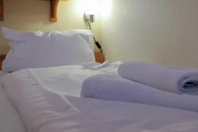 Ein Bett oder Betten in einem Zimmer der Unterkunft Frische Brise 03.04