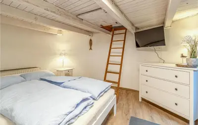 Ein Bett oder Betten in einem Zimmer der Unterkunft 2 Bedroom Beautiful Home In Otterndorf