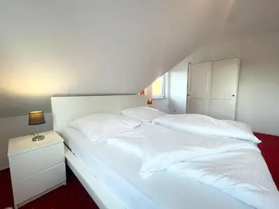Ein Bett oder Betten in einem Zimmer der Unterkunft Ferienhaus 'Haus Eversand'