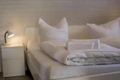 Ein Bett oder Betten in einem Zimmer der Unterkunft Ferienwohnung 'Haus Ingeborg, Wohnung 1/EG'
