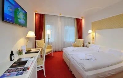 Ein Bett oder Betten in einem Zimmer der Unterkunft Ringhotel Gardels