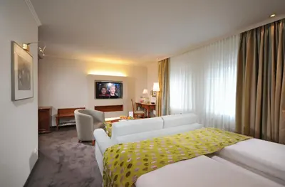 Ein Bett oder Betten in einem Zimmer der Unterkunft Ringhotel Gardels