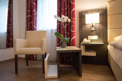 Ein Bett oder Betten in einem Zimmer der Unterkunft Hotel Stadt Cuxhaven