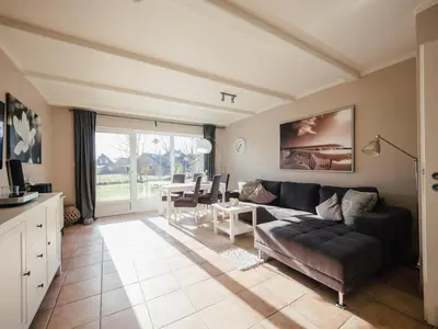 Ein Sitzbereich in der Unterkunft Beachcomber House B