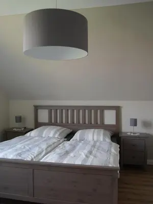 Ein Bett oder Betten in einem Zimmer der Unterkunft Ferienwohnung Zwischen Marsch u. Geest