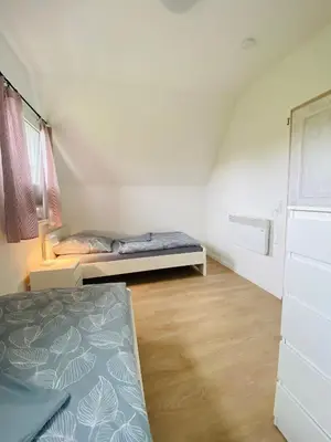 Ein Bett oder Betten in einem Zimmer der Unterkunft Ferienhaus Kiebitz